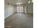 Spacious living room with double doors leading to patio at 19422 N 67Th Ln, Glendale, AZ 85308