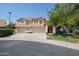 Two-story home with three-car garage and well-manicured lawn at 19422 N 67Th Ln, Glendale, AZ 85308