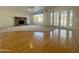 Living room features a stone fireplace, hardwood floors, and access to the backyard at 19422 N 67Th Ln, Glendale, AZ 85308
