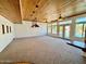 Spacious Gathering room with wood ceilings, multiple ceiling fans, and pool access at 19422 N 67Th Ln, Glendale, AZ 85308