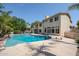 Large backyard pool with diving board and spacious patio at 19422 N 67Th Ln, Glendale, AZ 85308