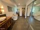 Luxurious bathroom boasts a soaking tub, walk-in shower, and double vanity at 19422 N 67Th Ln, Glendale, AZ 85308