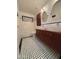 Updated bathroom with double vanity, subway tile, and checkered floor at 19422 N 67Th Ln, Glendale, AZ 85308