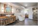 Spa-like bathroom with a soaking tub, walk-in shower, and modern vanity at 19422 N 67Th Ln, Glendale, AZ 85308