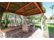 Relaxing patio with covered pergola and seating area, perfect for outdoor dining at 19422 N 67Th Ln, Glendale, AZ 85308