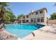 Inviting freeform pool with a diving board and large patio at 19422 N 67Th Ln, Glendale, AZ 85308