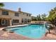 Inviting backyard oasis with a sparkling pool and basketball hoop at 19422 N 67Th Ln, Glendale, AZ 85308