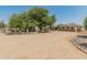 House exterior showcasing a large front yard, gated entrance, and a sprawling landscape at 23907 N 83Rd Ave, Peoria, AZ 85383