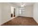 Bright bedroom with tile flooring and ceiling fan, adjacent to bathroom at 23907 N 83Rd Ave, Peoria, AZ 85383