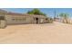 Rear exterior view showing solar panels and a paved patio area at 23907 N 83Rd Ave, Peoria, AZ 85383