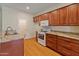 Modern kitchen featuring granite countertops and wood cabinets at 23907 N 83Rd Ave, Peoria, AZ 85383