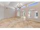 Open dining room with high ceilings, large windows, and chandelier at 23907 N 83Rd Ave, Peoria, AZ 85383