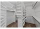 Spacious walk-in closet with custom shelving and hanging rods at 23907 N 83Rd Ave, Peoria, AZ 85383