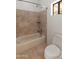 Clean bathroom with tile shower/tub combo and toilet at 23907 N 83Rd Ave, Peoria, AZ 85383