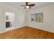 Bedroom with wood flooring and ceiling fan at 23907 N 83Rd Ave, Peoria, AZ 85383