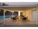 Covered patio with dining table and pool view at 5818 N Granite Reef Rd, Scottsdale, AZ 85250