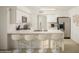 Modern kitchen with breakfast bar and stainless steel appliances at 5818 N Granite Reef Rd, Scottsdale, AZ 85250