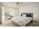 Main bedroom with king-size bed and access to the living room at 5818 N Granite Reef Rd, Scottsdale, AZ 85250