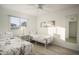 Bedroom with twin beds, window, and mirrored closet at 5818 N Granite Reef Rd, Scottsdale, AZ 85250