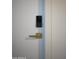 Modern door with a sleek gold handle and keyless entry at 5818 N Granite Reef Rd, Scottsdale, AZ 85250