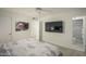 Bedroom with queen bed, en-suite bathroom, and wall-mounted TV at 5818 N Granite Reef Rd, Scottsdale, AZ 85250