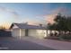 Updated home exterior boasts a modern design with a carport and landscaping at 5818 N Granite Reef Rd, Scottsdale, AZ 85250