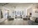 Spacious living room with sectional sofa, large windows, and high ceilings at 5818 N Granite Reef Rd, Scottsdale, AZ 85250