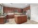 Kitchen features granite countertops, stainless steel appliances, and an island at 2336 W Laredo Ln, Phoenix, AZ 85085