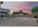 View of backyard from covered patio and sunset at 2336 W Laredo Ln, Phoenix, AZ 85085