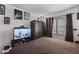 Bedroom with a TV, large bed, and ample closet space at 13164 W Ocotillo Ln, Surprise, AZ 85374
