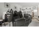 Living room with a large sectional sofa, built-in shelving, and large TV at 13164 W Ocotillo Ln, Surprise, AZ 85374