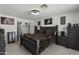Bright bedroom with king-size bed and access to bathroom at 13164 W Ocotillo Ln, Surprise, AZ 85374