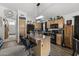 Bright kitchen features an island, wood cabinets, and a pantry at 13164 W Ocotillo Ln, Surprise, AZ 85374