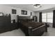 Large bedroom with dark wood furniture and window at 13164 W Ocotillo Ln, Surprise, AZ 85374