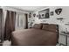 Spacious bedroom with large bed, window, and wall decor at 13164 W Ocotillo Ln, Surprise, AZ 85374