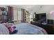 Bright bedroom with a bed, window, and plenty of storage at 13164 W Ocotillo Ln, Surprise, AZ 85374