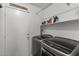 Laundry room with washer, dryer, and shelving for storage at 13164 W Ocotillo Ln, Surprise, AZ 85374