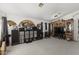 Spacious living room with built-in entertainment center and carpeting at 13164 W Ocotillo Ln, Surprise, AZ 85374
