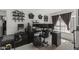 Home office with a large desk, multiple monitors and exercise equipment at 13164 W Ocotillo Ln, Surprise, AZ 85374