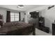 Spacious bedroom with large bed, dresser, and window at 13164 W Ocotillo Ln, Surprise, AZ 85374