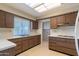 Kitchen with wood cabinets and a window at 15630 N Lakeforest Dr, Sun City, AZ 85351