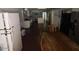 Long view of kitchen, dining area, and living room at 1517 W Sahuaro Dr, Phoenix, AZ 85029