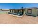 House exterior, light green with a small yard at 1517 W Sahuaro Dr, Phoenix, AZ 85029