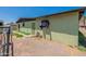 Back exterior of house showing a side yard at 1517 W Sahuaro Dr, Phoenix, AZ 85029