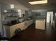 Efficient kitchen with island, microwave, and modern appliances at 1517 W Sahuaro Dr, Phoenix, AZ 85029