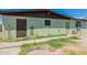 Back exterior of the house with storage at 1517 W Sahuaro Dr, Phoenix, AZ 85029