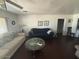 Living room with dark floors and comfy seating at 1517 W Sahuaro Dr, Phoenix, AZ 85029