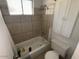 Updated bathroom with a tub, shower, and storage cabinet at 1517 W Sahuaro Dr, Phoenix, AZ 85029