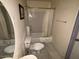 Clean bathroom with shower/tub combo and tile floor at 1517 W Sahuaro Dr, Phoenix, AZ 85029