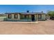 Light green single story home with a small front yard at 1517 W Sahuaro Dr, Phoenix, AZ 85029